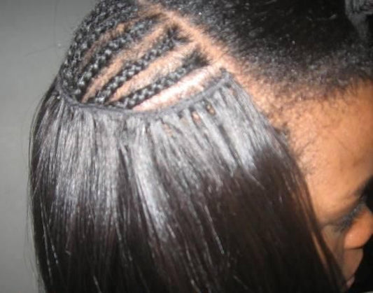 showcasing raw hair bundles being installed